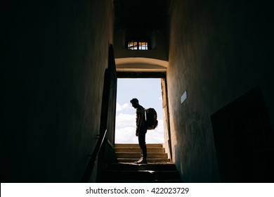 silhouette of a man with a backpack