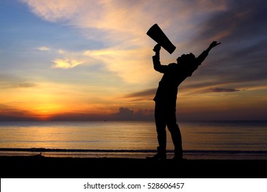 Silhouette Man And Bullhorn Megaphone Shout On Sunset Time