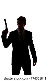 Silhouette Of Man In Business Suit With Gun At Hand Isolated On White Background