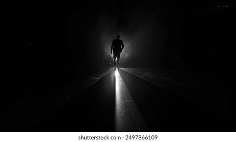 Silhouette of a man in classic suit against a backlight. A sophisticated and elegant image ideal for highlighting professionalism, formal events, and stylish fashion. - Powered by Shutterstock