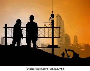 silhouette man engineer looking blueprint in a building site over Blurred construction worker on construction site - Shutterstock ID 263120963