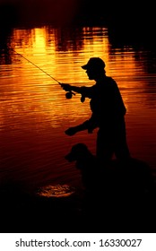 Silhouette Of Man Fly Fishing With His Dog