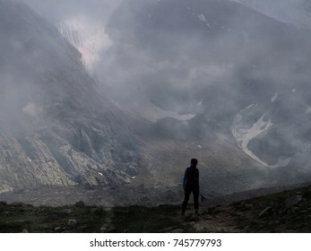 silhouette of a man in a fog in the mountains - Shutterstock ID 745779793