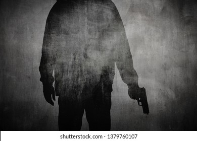 Silhouette Of A Man Holding A Gun