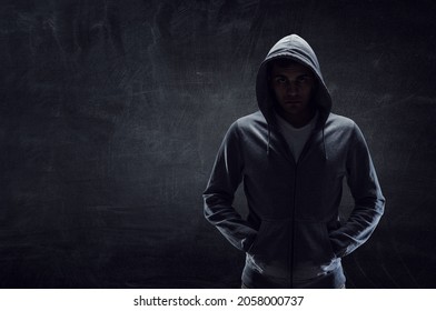 Silhouette of man in hoody - Powered by Shutterstock