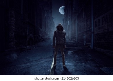 Silhouette of man in hoody - Shutterstock ID 2145026203