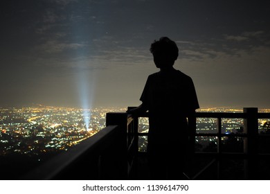 Silhouette Man Looking At Night City And Night Sky Backgound