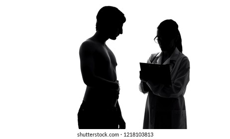 Silhouette of man at medical examination, female doctor writing prescription - Powered by Shutterstock