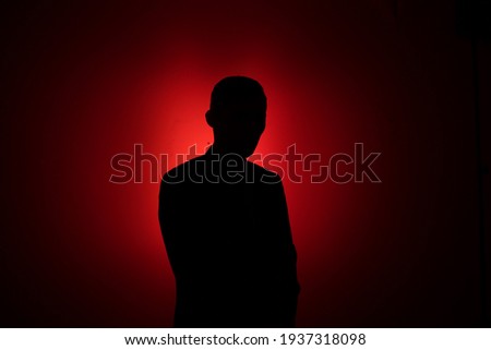 Similar – Image, Stock Photo Mysterious Man with Red Eyes in Dark Ambience and red contact lenses