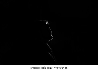 Silhouette Of Man Over Dark Concrete Background For Your Text