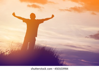silhouette of man pointing with finger in sky  - Shutterstock ID 450103984