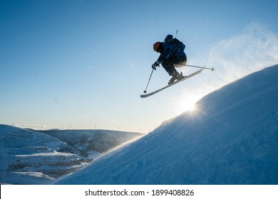 Silhouette of a man skiing in the Chic Chocs in Quebec Canada