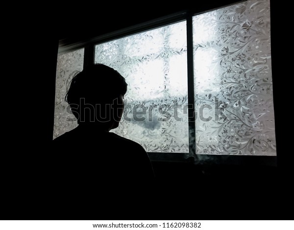 Silhouette Man Smoking Against Window His Royalty Free