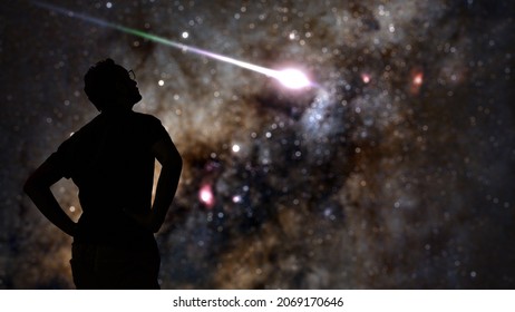 Silhouette Of A Man Stargazing Under The Milky Way Skies.