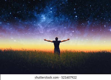 Silhouette of man and stars sky. Elements of this image furnished by NASA