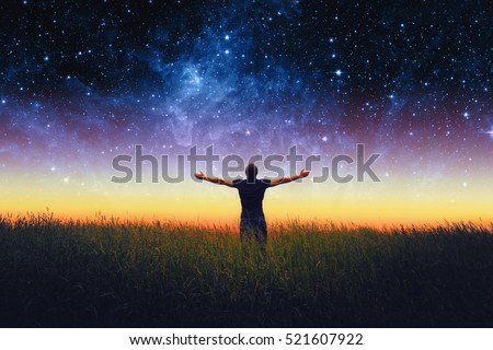Silhouette of man and stars sky. Elements of this image furnished by NASA
