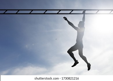 Silhouette of a man swinging across a monkey bar against a surreal blue sky.  - Powered by Shutterstock - Get 15% off with code: PIKWIZARD15