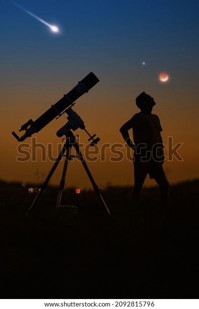 Silhouette of a man, telescope and\
countryside under the starry skies with young\
Moon.