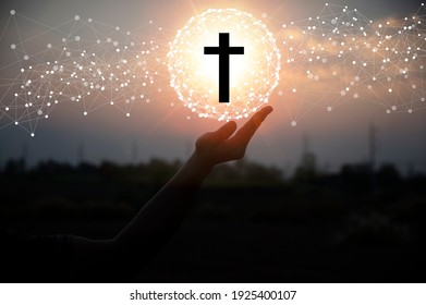 Silhouette a man use hand holding wooden cross with sunset backgrounds, religion concept, international prayer day. - Powered by Shutterstock