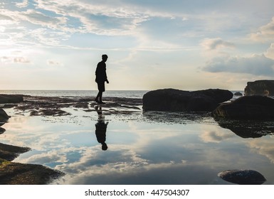 Silhouette, A Man Walking With Reflection On Water, Vintage Tone, Selective Focus