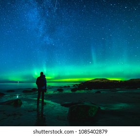 Silhouette Of Man Watching The Northern Lights In Norway