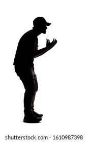 Silhouette Of A Man Wearing Casual Clothes Isolated On A White Background. He Is Being Rude And Angry