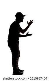 Silhouette Of A Man Wearing Casual Clothes Isolated On A White Background. He Is Being Rude And Angry