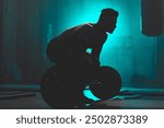 Silhouette, man and weightlifting with barbell for workout, exercise or training in fitness at gym. Active male person or bodybuilder lifting bar for muscle gain, strength or practice at health club