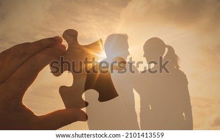 Silhouette of Man woman in love holding hugging. Relationship, and finding your sole mate concept. Silhouette loving couple at sunset.