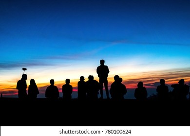 Silhouette Of Many People Watching Sunrise.