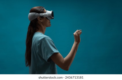 Silhouette of a medical practitioner engages with a augmented reality, exploring spatial computing possibilities for advanced patient care - Powered by Shutterstock