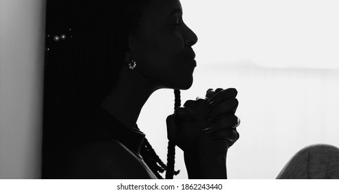 Silhouette Meditative Black Woman Praying During Hard Times