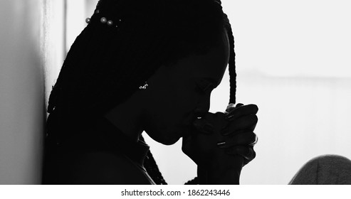 Silhouette Meditative Black Woman Praying During Hard Times