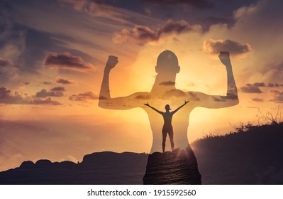 Silhouette of mental and physically strong woman standing on a mountain top. People, power, and strength concept.   - Shutterstock ID 1915592560