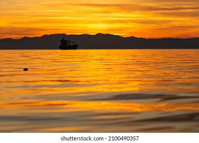 Silhouette Of A Merchant Ship During Sunset In Thessaloniki Greece 03.01.2022