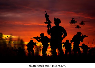 Silhouette of military soldiers with weapons dark background. Law and military concept.