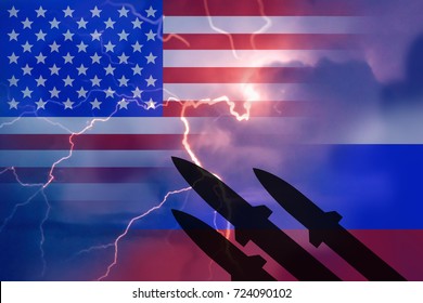 Silhouette Of Missiles Against The Background Of The Flag Of Russia And The US Flag And Lightning In The Background. Symbolizes Russia's Aggression Towards The US.