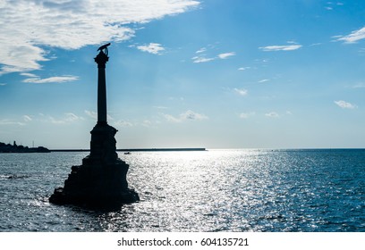Silhouette of the monument to the Scuttled Ships in Sevastopol  in sunset - Shutterstock ID 604135721