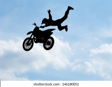 Silhouette Of Motorcycle Rider Performing Trick