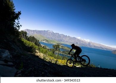 Silhouette Of Mountain Bike Rider In Queenstown, New Zealand