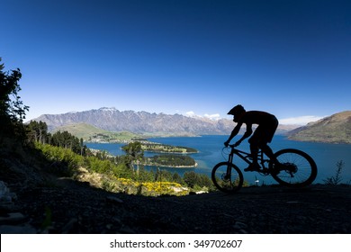 Silhouette Of Mountain Bike Rider In Queenstown, New Zealand