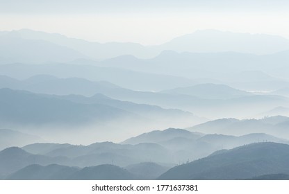 silhouette of the mountains in the mist - Powered by Shutterstock