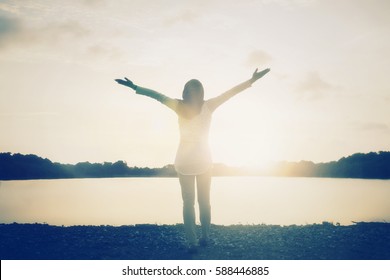 Silhouette muslim peace woman casual hand rise up morning. Women person emotions worship God praise on victory water prayer sunset concept for freedom reborn, bible vision mission, accepted surrender.