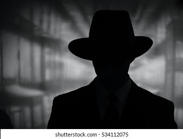 Silhouette Of A Mysterious Man In A Vintage Style Wide Brimmed Hat In A Close Up Black And White Head And Shoulders Portrait