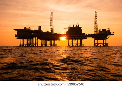 Silhouette of offshore oil installation 