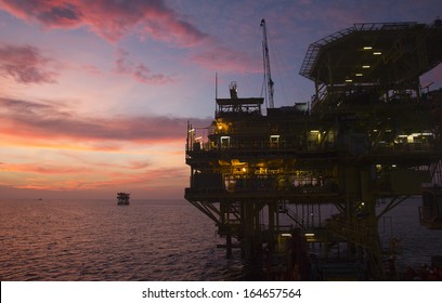 Silhouette Of An Offshore Oil Rig At Sunset