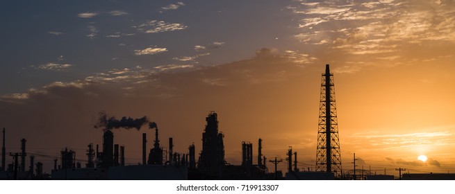 Silhouette Oil Refinery At Sunrise. Oil Factory, Petrochemical Plant Tower, Gas Flare, Smoke Stacks And Machinery In Corpus Christi, Texas, USA. Petroleum Industry Background. Panorama Style.