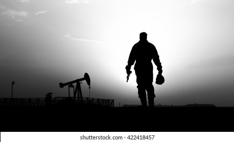 Silhouette Of Oilfield Worker And Crude Oil Pump In Background- Oilfield  - Sunset - Black And White