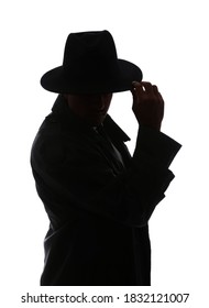 Silhouette of old fashioned detective on white background