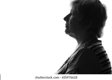 Silhouette Of An Old Sad Woman